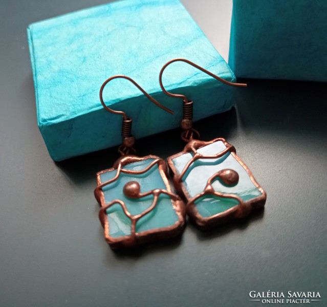Unique handmade earrings made of light blue glass