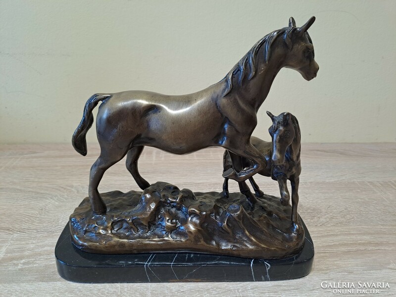 Bronze statue of a horse with a foal