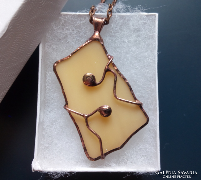 Handmade beige glass pendant with copper wire decoration