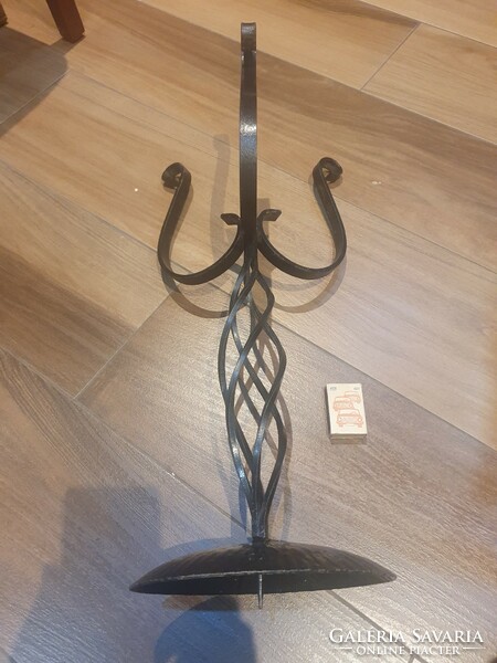 Huge wrought iron candle holder with giant candle