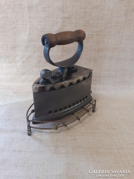 Old cast iron iron with ironing pad