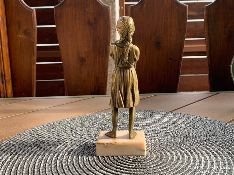Bronze statue of a girl carrying water on a marble base