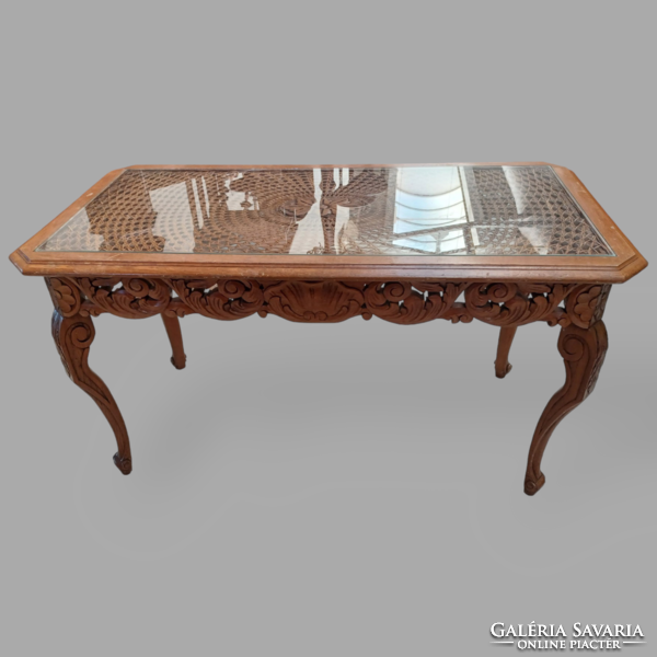 Coffee table with baroque openwork carving and glass top