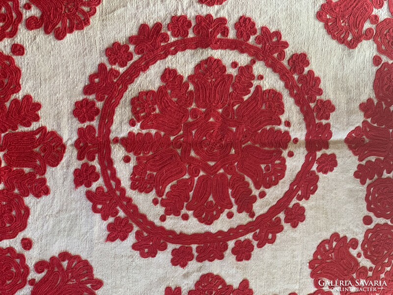Richly embroidered tablecloth with a written pattern