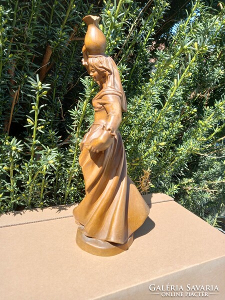A lady carrying a jar! 30 Cm wooden statue!