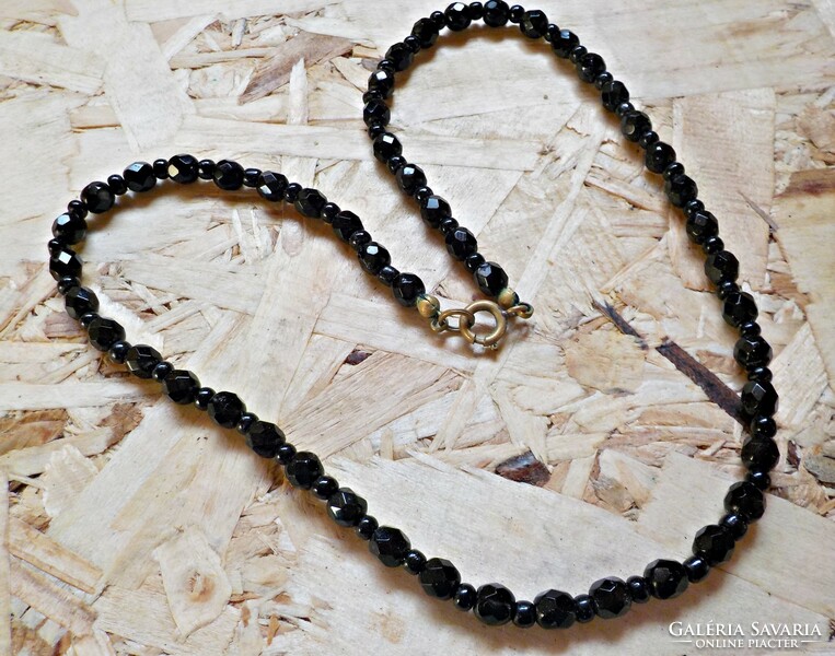 Old black polished glass bead necklace with copper clasp