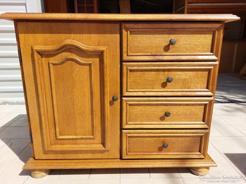 A 4-drawer oak chest of drawers with doors for sale. Furniture is beautiful, in like-new condition.