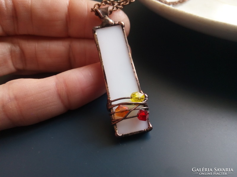 Beautiful glass pendant made of white glass and colorful tiny pearls