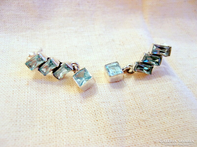 Special silver earrings with blue topaz stone decoration