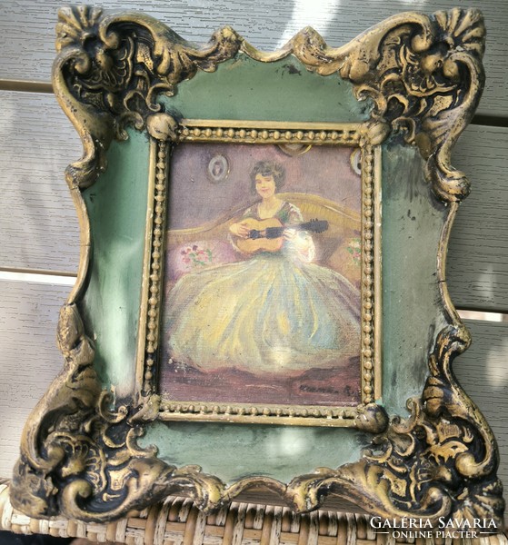 Antique interior painting with lady in blonde frame