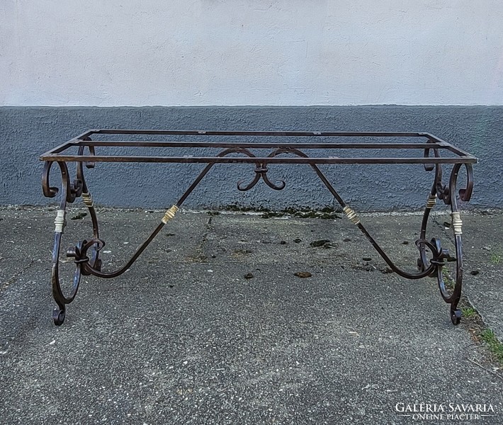 Special, old forged garden table frame with copper elements