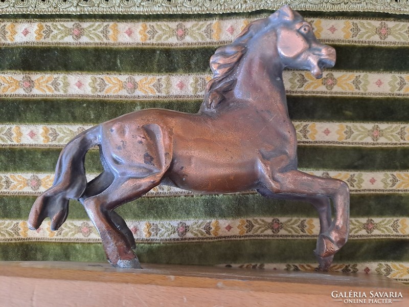Bronzed horse on pedestal