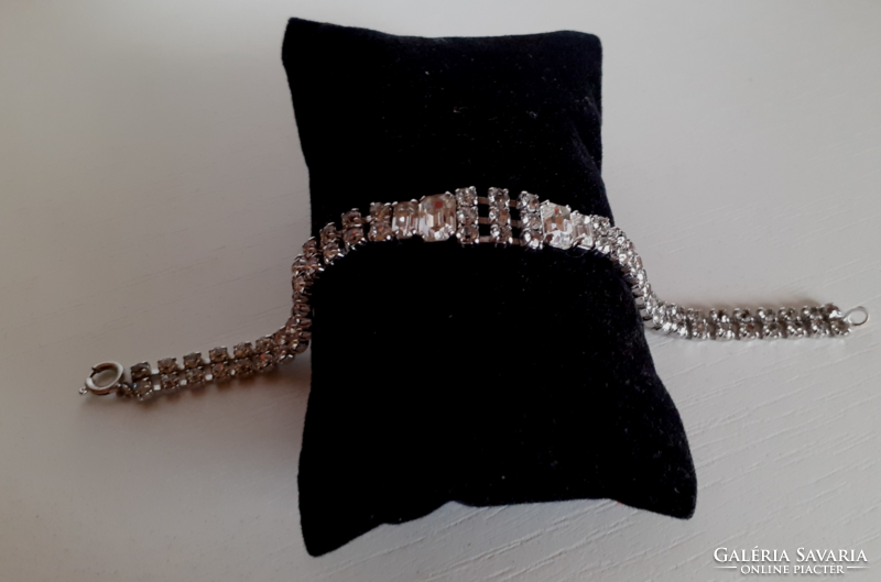 Old white bracelet studded with polished rhinestones