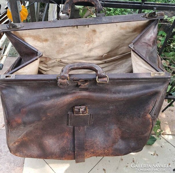 Antique large leather bag. For theater props and decorations.