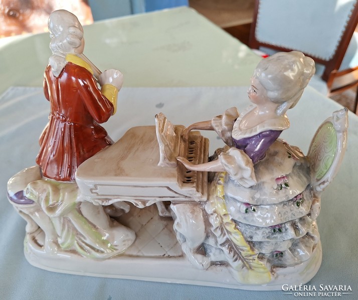 Gräfenthal - porcelain figures of a lady playing the piano and a gentleman playing the violin. The dog under the piano