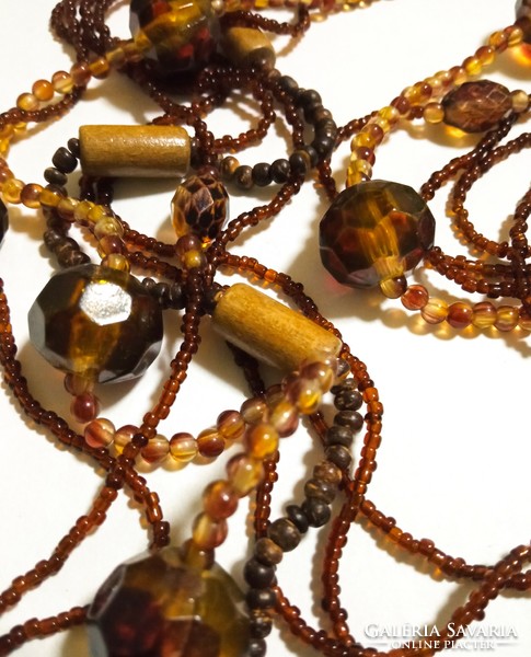 Fashion necklace - long brown with several rows of mixed pearls