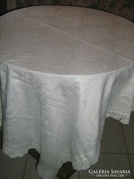 Beautiful damask tablecloth with hand-crocheted flower and Toledo pattern