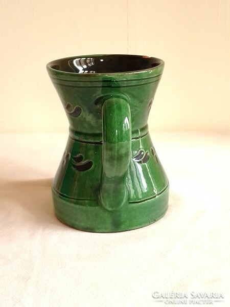 Old green glazed ceramic pitcher, large mug, folk pattern
