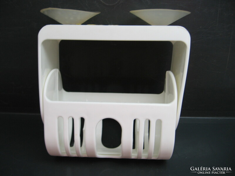 White plastic soap holder that can be installed on three sides