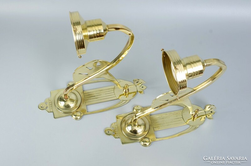 A pair of Art Nouveau wall arm lamps