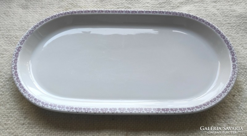 A porcelain roasting dish with a beautiful purple pattern marked by the Great Plains