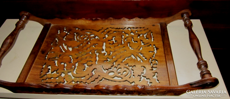 Old wooden tray with an openwork pattern