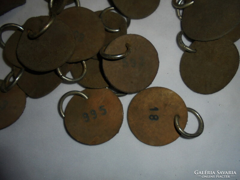 Leather, circular, numbered ticket with metal hanger - 84 pieces in total