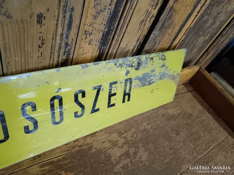 Old glass sign with painted detergent label, mid-20th century household store, colander store,