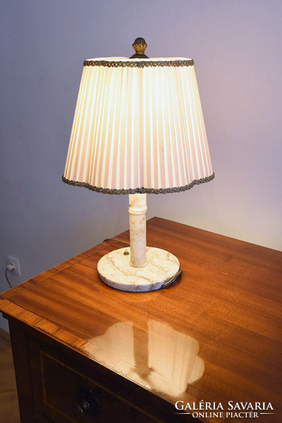 A table lamp with a marble base, with a white silk shade, a copper cone with tongs, xx. First half of No