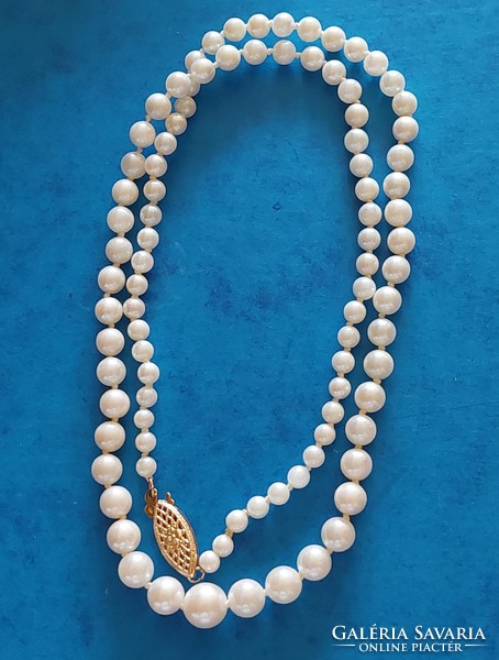 Real pearl necklace with 10k gold jewelry clasp, knotted string, growing pearls
