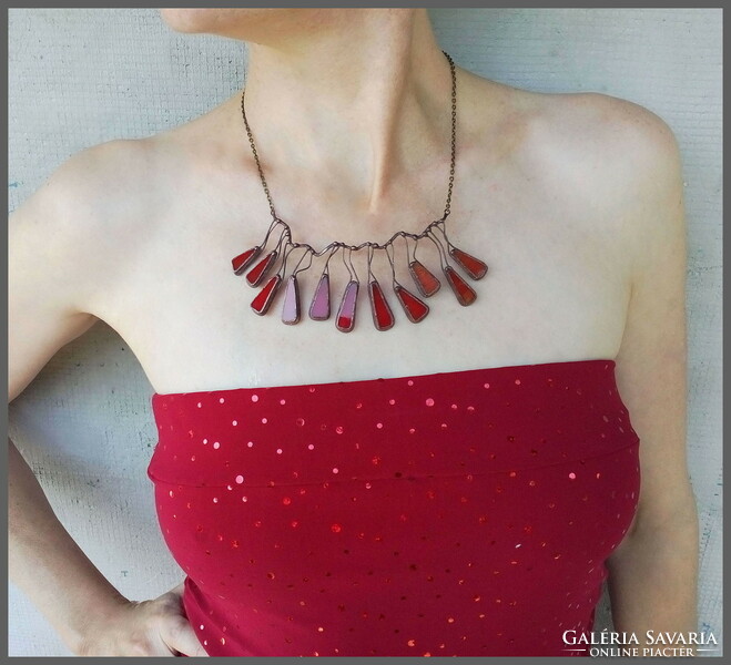 A unique, high-quality handcrafted product, a necklace made of red glass