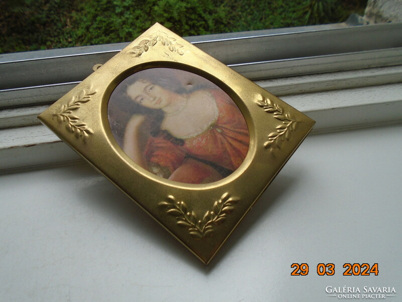 Gilded embossed copper frame with a portrait of an antique Venetian aristocratic lady