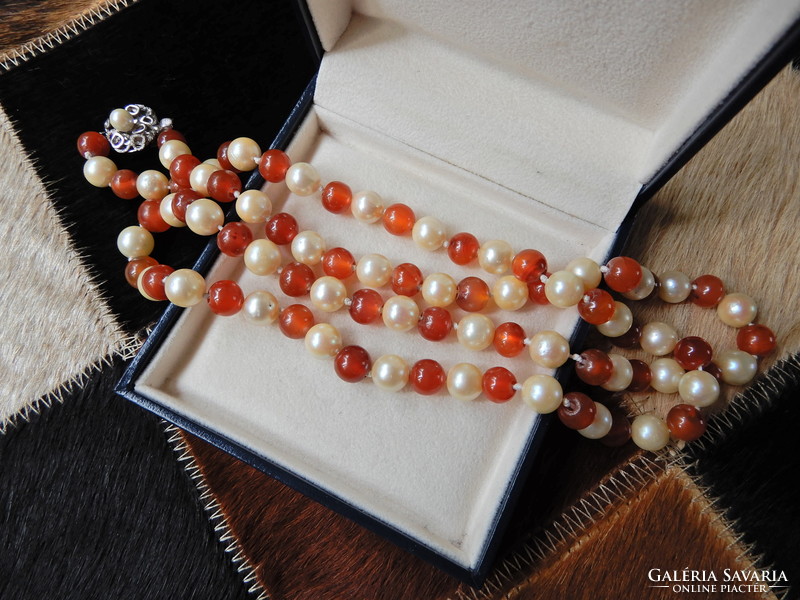 Old long string of true pearls with carnelian and silver clasp
