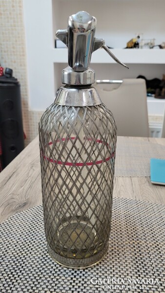 Old wire mesh soda bottle.
