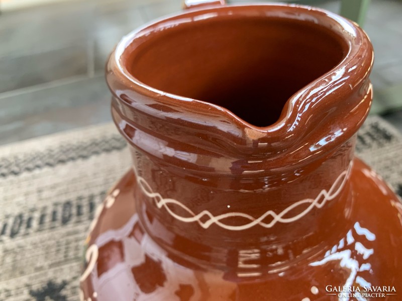Large glazed ceramic jug from Hódmezővásárhely with a flower decoration painted in a circle, 32 cm.