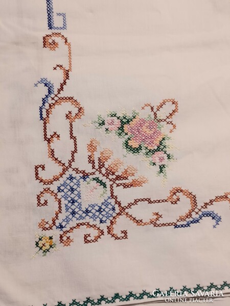 Linen tablecloth with a cross stitch pattern