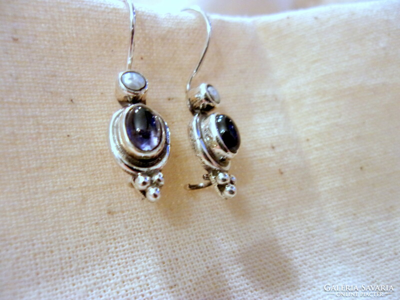 Fine-looking silver earrings decorated with freshwater pearls and lolite stones
