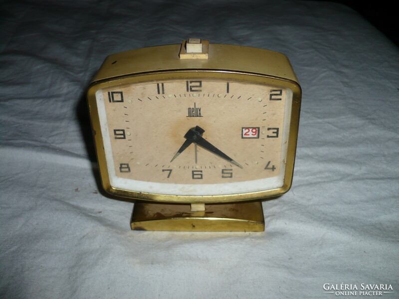 Old retro wind-up melux table alarm clock