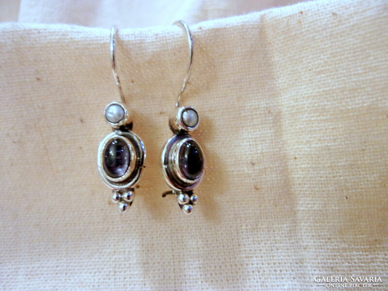 Fine-looking silver earrings decorated with freshwater pearls and lolite stones