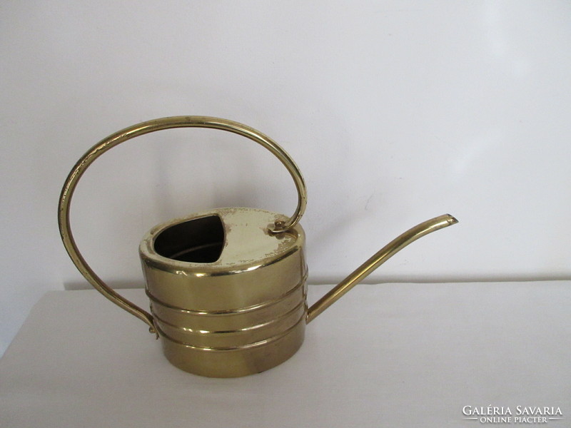 2 Liter, old brass watering can. Negotiable!