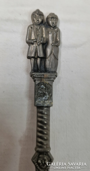 Old metal spoons with a special shape, decorated with human figures, are sold together