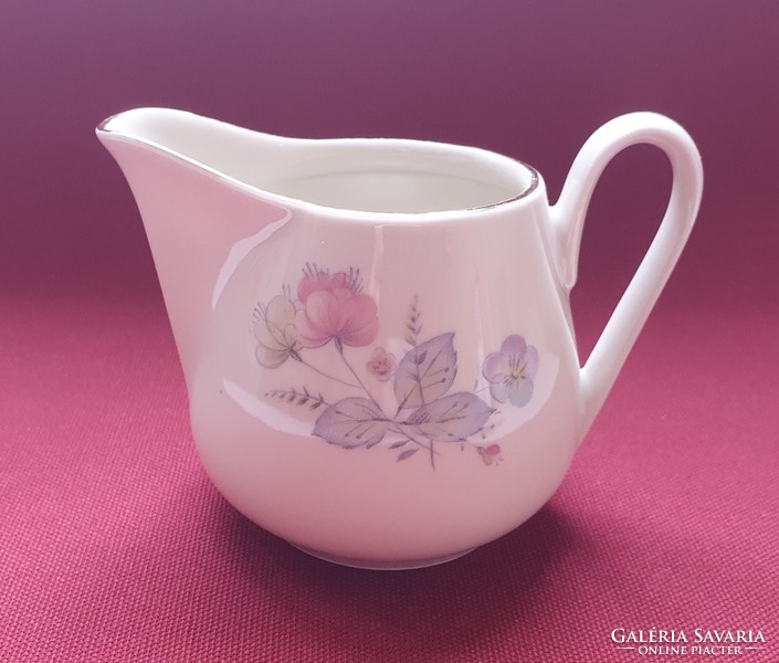 Porcelain pouring milk cream with flower pattern