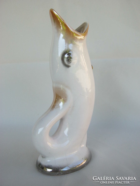 Craftsman in retro ceramic fish shaped vase