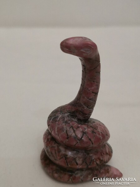 Carved rhodonite mineral snake