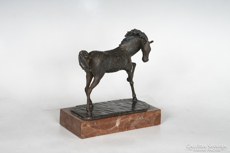Abstract bronze horse figure on a marble plinth