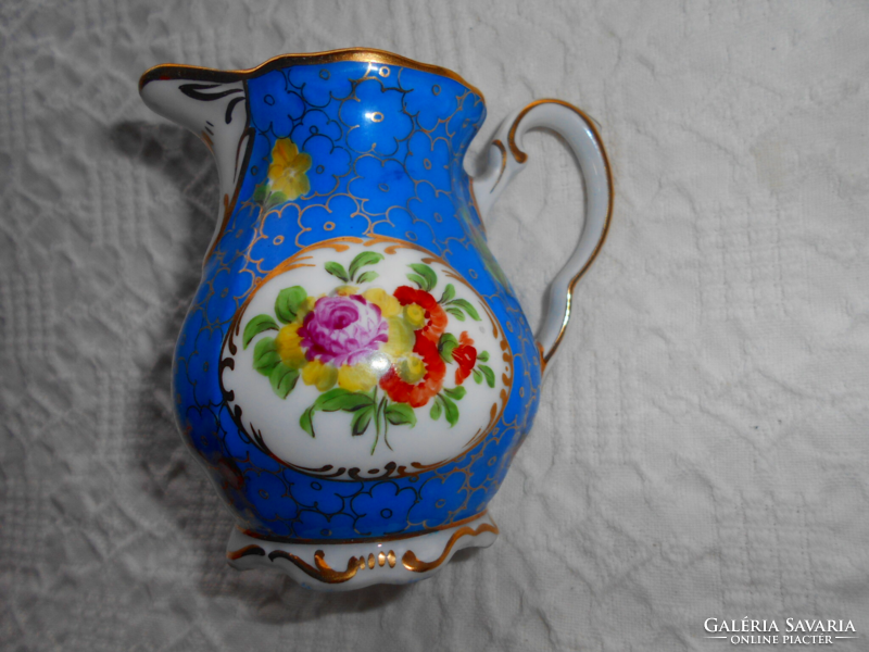 Hand-painted (fond painting) porcelain cream jug with flower pattern