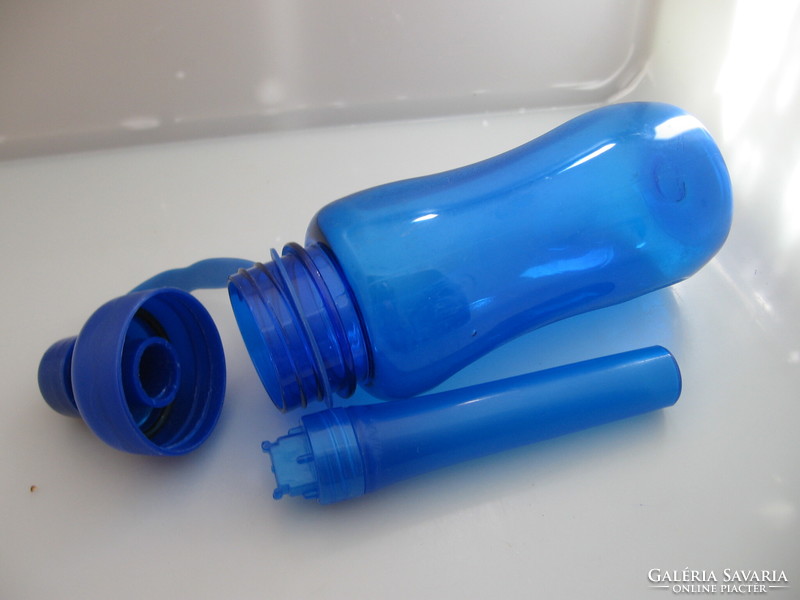 Blue plastic water bottle with cooling insert