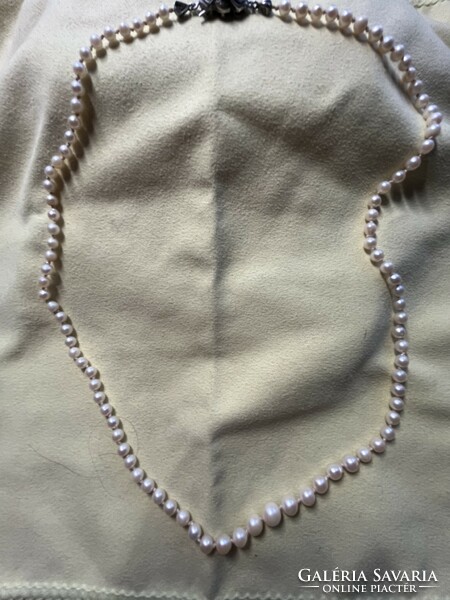 Freshwater cultured pearl string with 835 hallmarked safety lock.