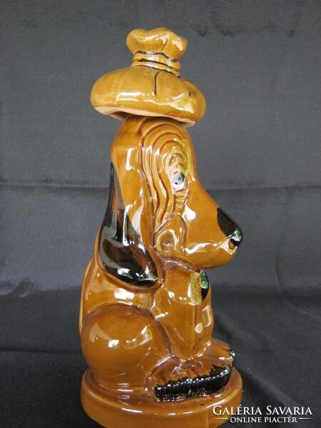 Fun ceramic dog bottle pouring drink offering brandy