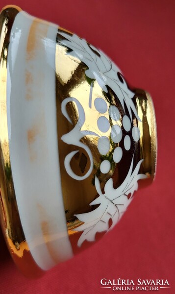 Richly gilded grape patterned porcelain bowl serving centerpiece